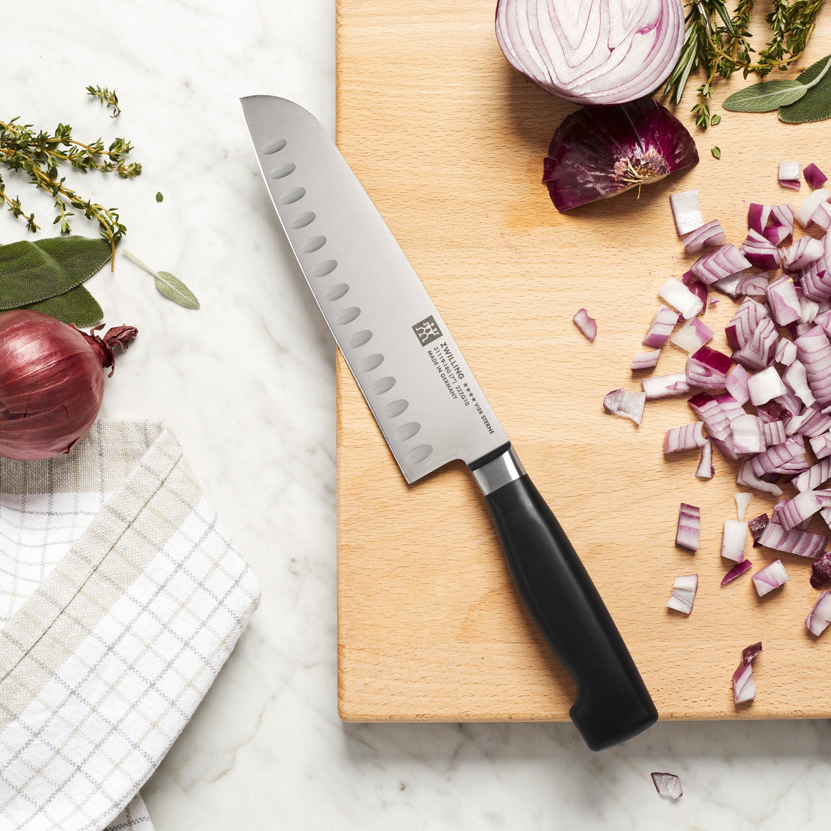 ZWILLING Four Star Santoku 7 inch, hollow edge